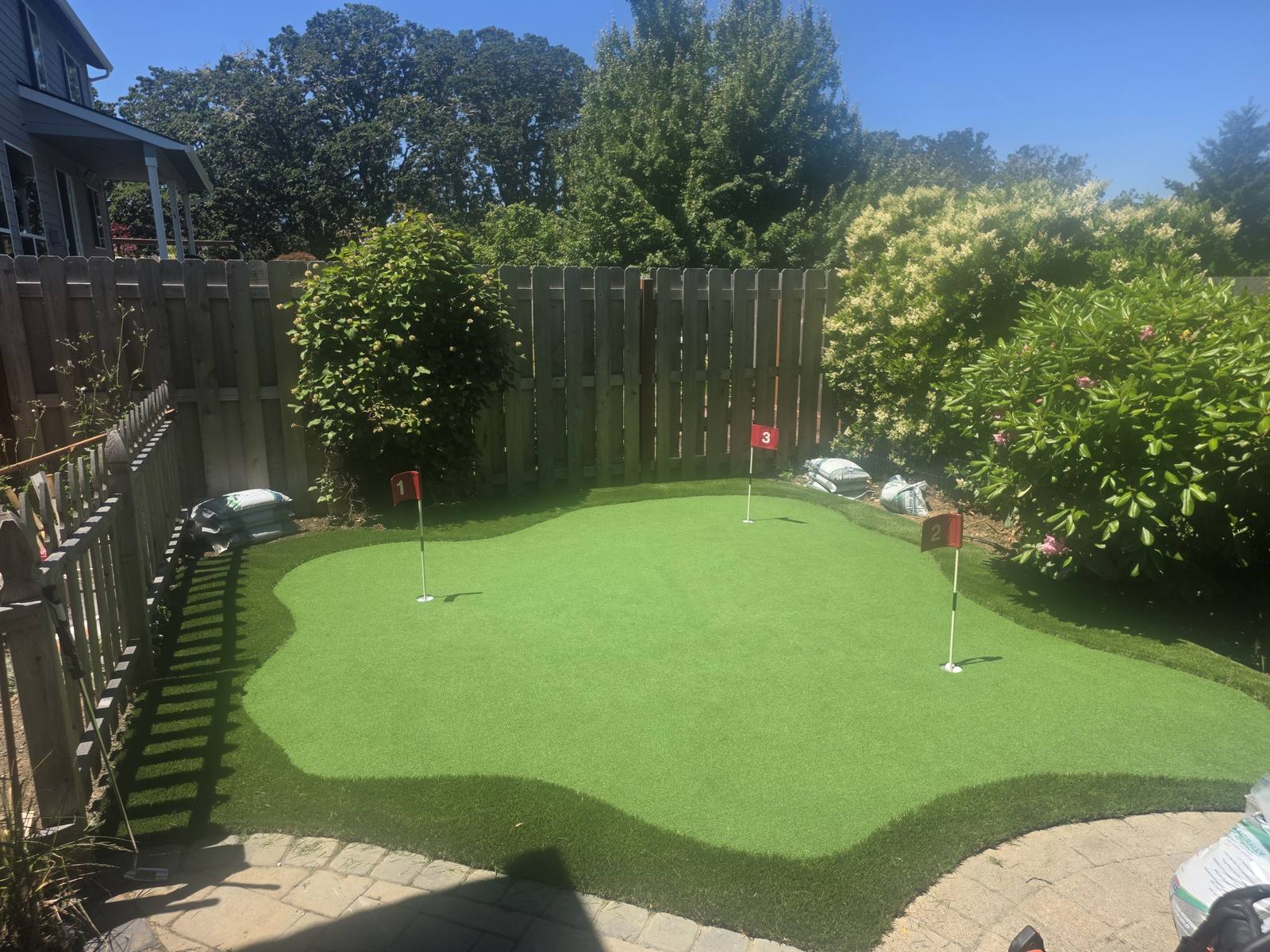 Custom 3-hole backyard putting green installed by TurfPROS in Corvallis, Oregon