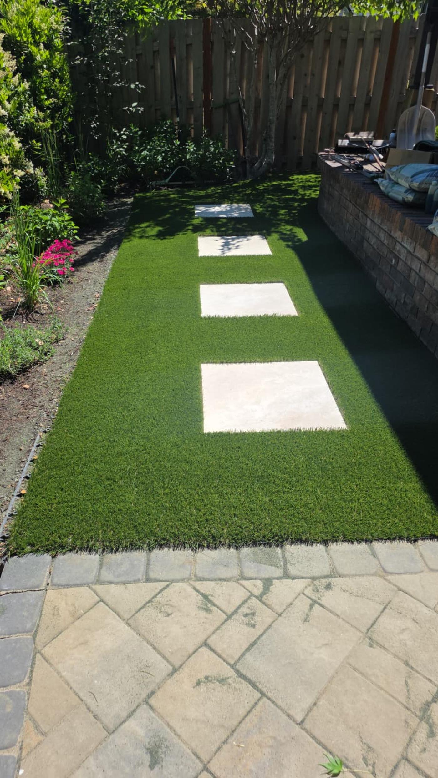 Artificial turf lawn with paver walkway installed by TurfPROS in Oregon
